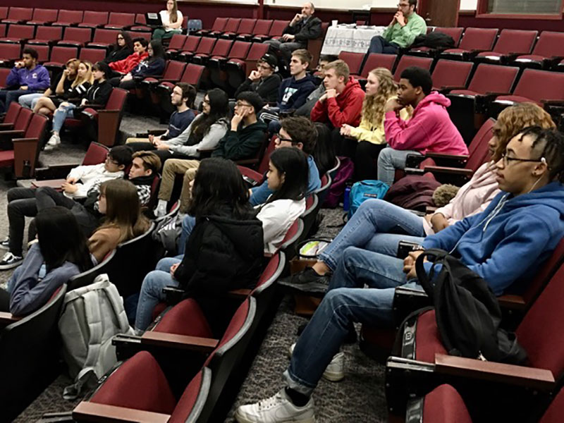 students in seats in auditorium