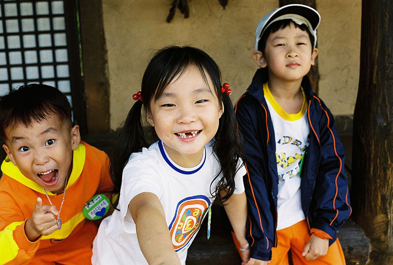 three smiling children