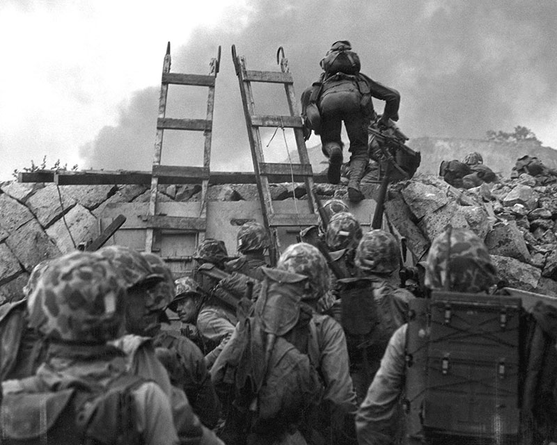 black and white photo of soldiers with ladders