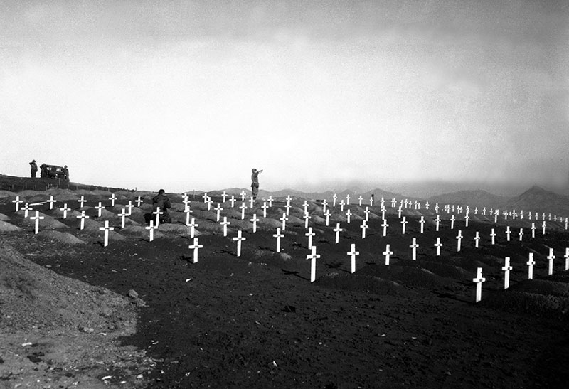black and white photo of bugler in military cemetery