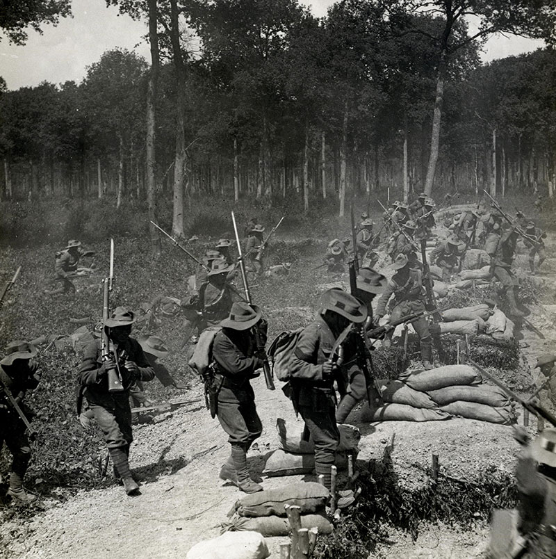 soldiers in battle with rifles and sandbags