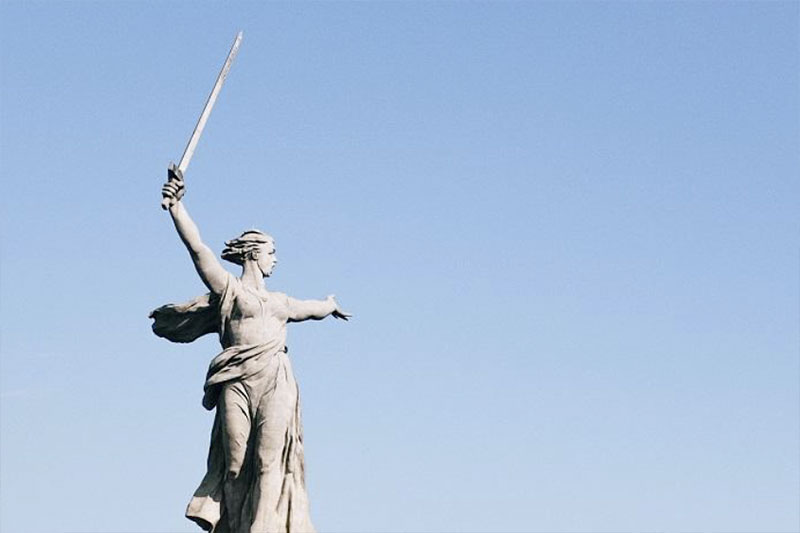 statue of woman with sword