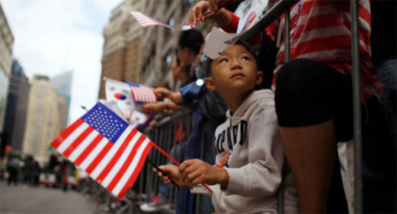 boy with flag at parade
