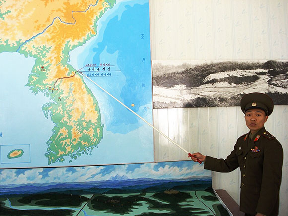 man pointing at map of Korea